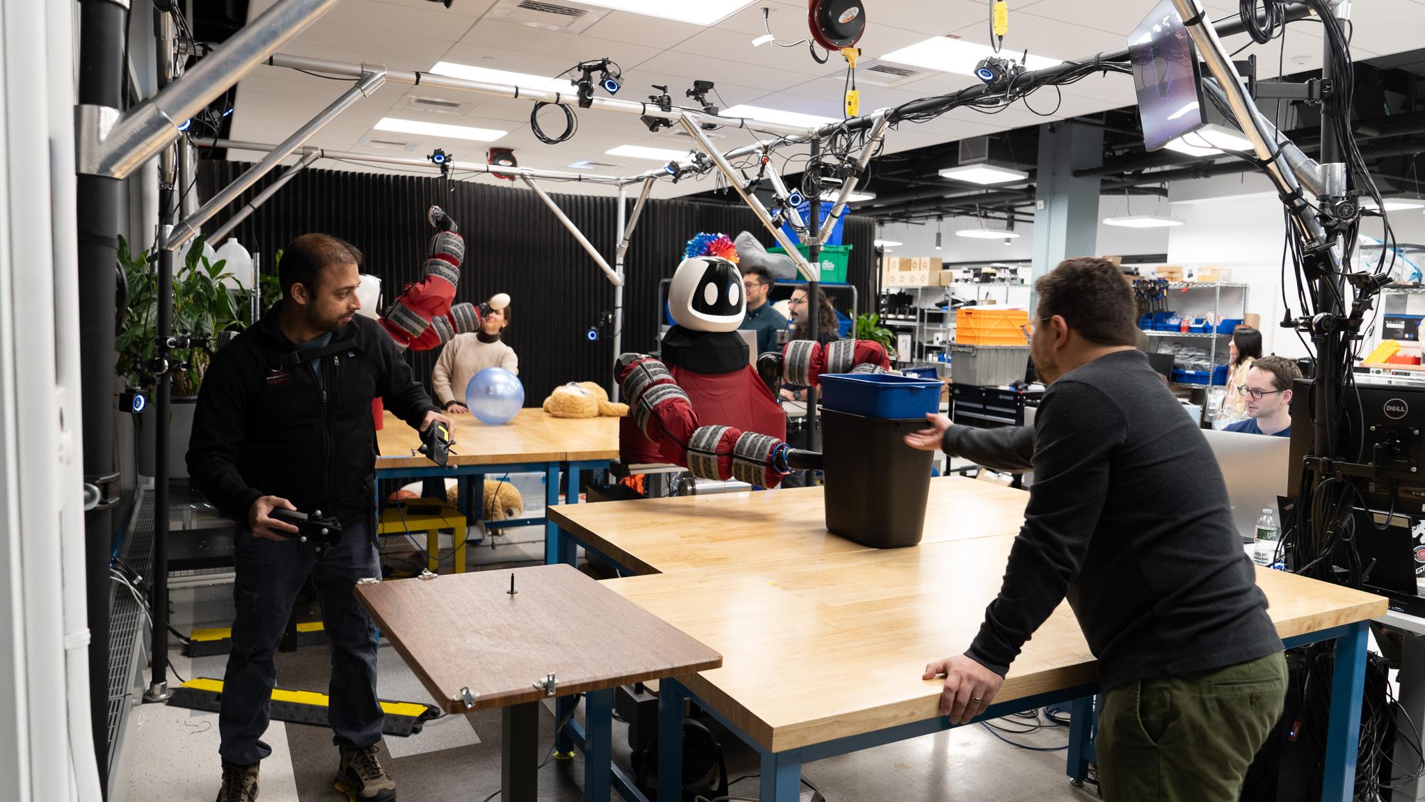 employees working in the robotics lab