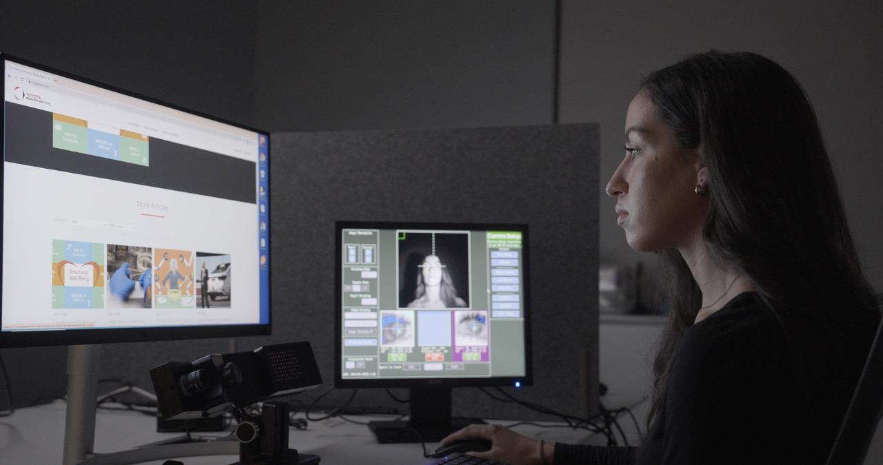 researcher with computer monitors